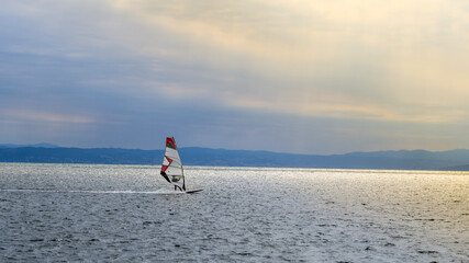 
Windsurfing in the harbor at sunset.