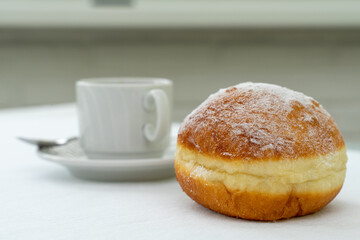 iced donut and a cup of coffee. breakfast concept