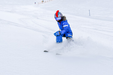 Fototapeta na wymiar Young skier on the slope.