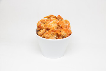 Dried shrimp in a white cup on a white background