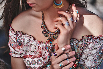 Gorgeous stylish boho chic woman. Fashionable indian hippie gypsy bohemian outfit with bijouterie accessories details © Goffkein