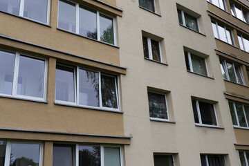 Fototapeta na wymiar Fragment of the facade of a residential city building.