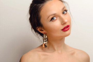 Portrait of Young Beautiful European Woman. Elegance CloseUp of Female Eye with Classic MakeUp and Liner. Beauty, Cosmetics and Makeup. Brown Eyeshadow on Eyelid. Red Lips