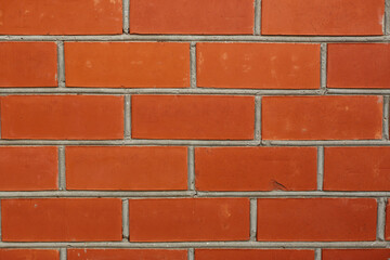 Red color brick wall for brickwork background design.