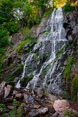 Waterfall on rocks in forest of Hohwald