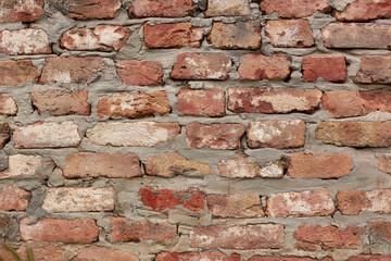 Red brick wall texture. Old rough orange brickwork background. Grunge large background.