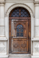 Vintage wooden door of brown color. Beautiful front door in an old city.