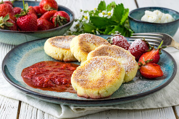 Cheesecakes with berry and sour cream. Yummy dessert
