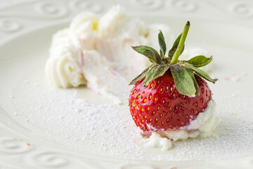 fresh strawberry with whipped cream, close view