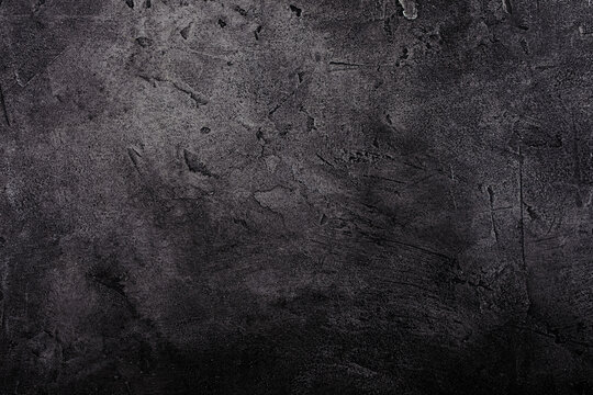 Black marble or concrete background (as an abstract background or stained marble or concrete texture)