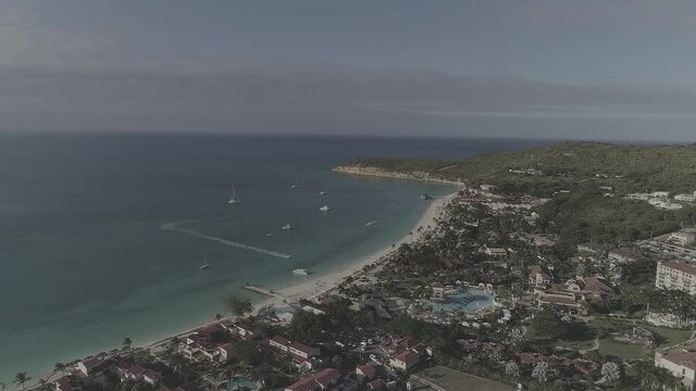 
Aerial shot of Antigua and
Barbuda. Sea, ocean, waves, coastline, sand, beach, palm trees, boats, corals, yachts, landscape, nature, drone video.