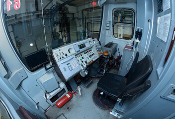 Subway train drivers cabin: seat, dashboard, speed control handle