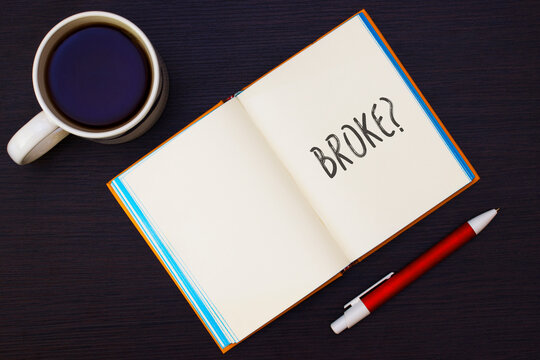 Paper notepad with word broken handwritten big letters