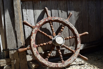The old wheel steering of the boat