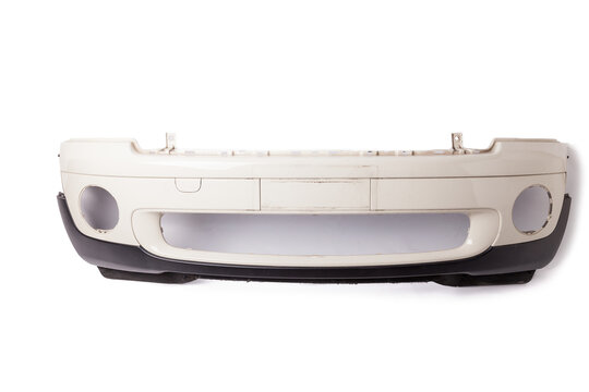 White Car Bumper With A Black Plastic Panel On An Isolated Background, Part For Installation On A Car Body After Repair And Painting During Repair In A Workshop. Equipment For Sale.