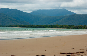 Four mile beach at Port Douglas with heavy storm clouds on the sky
