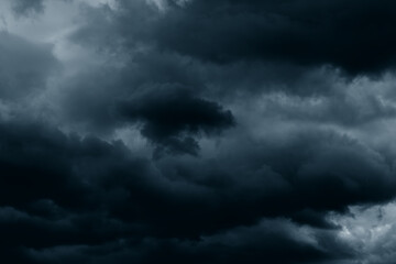 Stormy rain big fluffy clouds. Dark sky. Natural scenic abstract background. Weather changes backdrop. Sky filled with voluminous clouds.