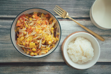 Somtum corn salad served with sticky rice