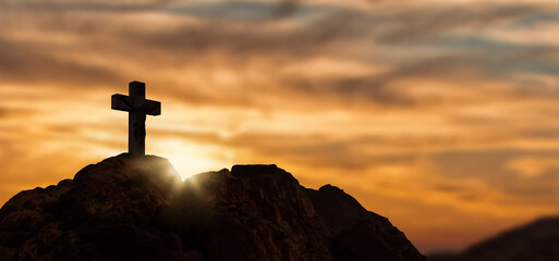 jesus Christ Cross On top of Hill At Sunset.