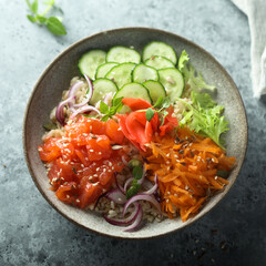 Healthy salmon poke bowl with quinoa