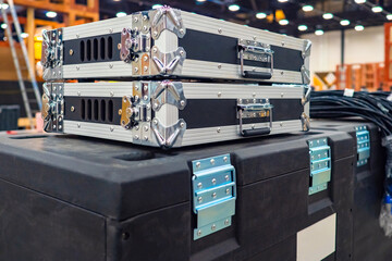 Naklejka premium Black cases for musical equipment. Cases for transporting audio apparatus. Concept - secure transportation equipment. Concept-sale of protective cases for sound equipment. Rental of apartments