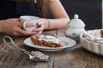 girl drinking cup of tea with brownie. food concept .