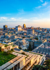 Genoa, Italy - CIRCA 2013: Genoa aerial cityscape at sunset as seen from Spianata Castelletto.