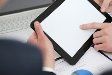 Fototapeta na wymiar Businessmen reading financial review at tablet pc