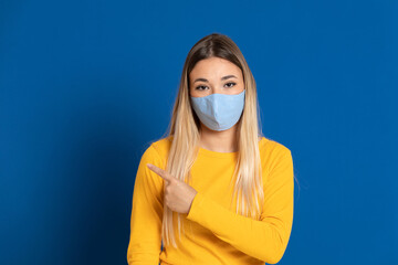 Blonde girl wearing a face mask