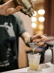 Barman mixing fresh cocktail at the restaurant