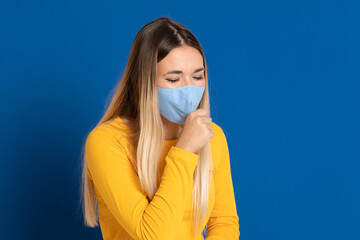 Blonde girl wearing a face mask