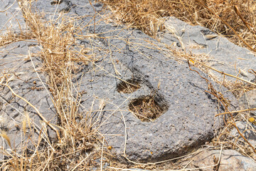 Prehistoric  ritual stone candlestick in ruins of main hall of Dir Aziz Synagogue, built in the Byzantine period, at the beginning of the sixth century AD. It is located on Golan Heights in Israel.