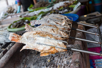 Pomegranate fish with salt and then burned for sales in the market. (Thai style street food. 