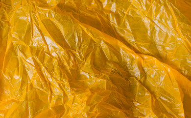 orange wrinkled foil bag. texture or background