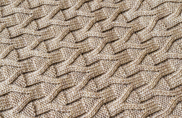 The texture of the knitted brown fabric for the background