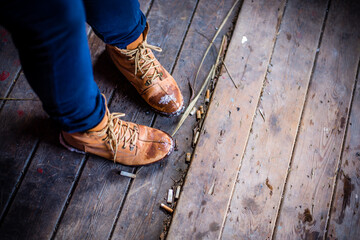 boots shoes on a wooden background with cigarettes