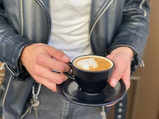 man holding a cup of coffee