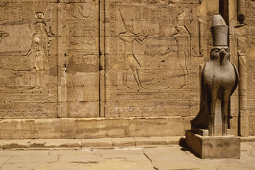 Hawk statue and hieroglyphics in the Edfu temple