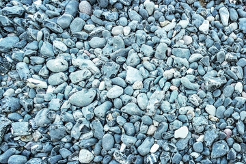 The texture of sea pebble. Close-up. Natural background. Recreation.