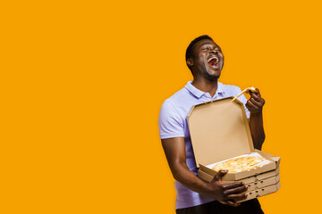 Funny black courier laughts and holds piece of pizza with 4 pizza boxes. 2+2 Big discount for...