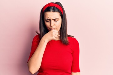 Young beautiful girl wearing casual t shirt and diadem feeling unwell and coughing as symptom for cold or bronchitis. health care concept.