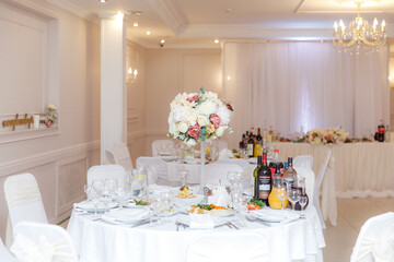 wedding table setting and decorated with flowers 