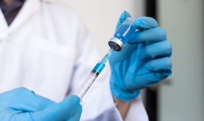 Scientists or doctors collect viral samples for preparation analysis and production of vaccines in the laboratory , Vaccine research to eliminate viruses concept.