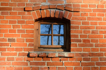 red brick masonry and window