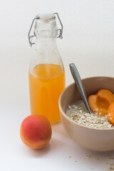 healthy Breakfast Cup with cereal and fruit and juice on a white background