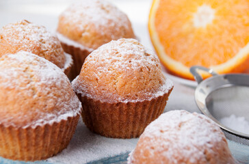 Orange muffins with icing sugar