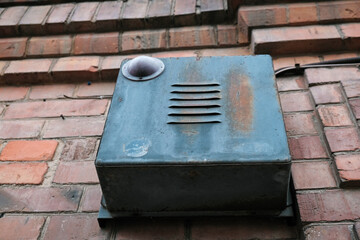 Close-up soviet signal device attached to a building