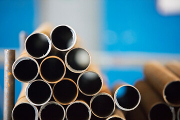 A stack of steel pipes. The industry for the manufacture of metal products.