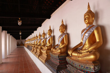 Perspective image of Buddha statue at cloisterse area in the Phutthaisawan Temple Ayutthaya.