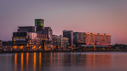 Fototapeta na wymiar Sunset lights over Rotterdam city